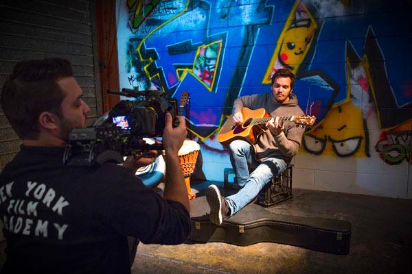 NYFA Students filming a scene with a guitar