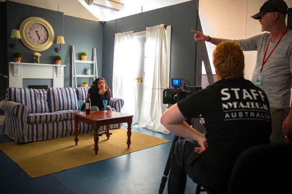 NYFA Australia students and staff setting a film scene in a living room set